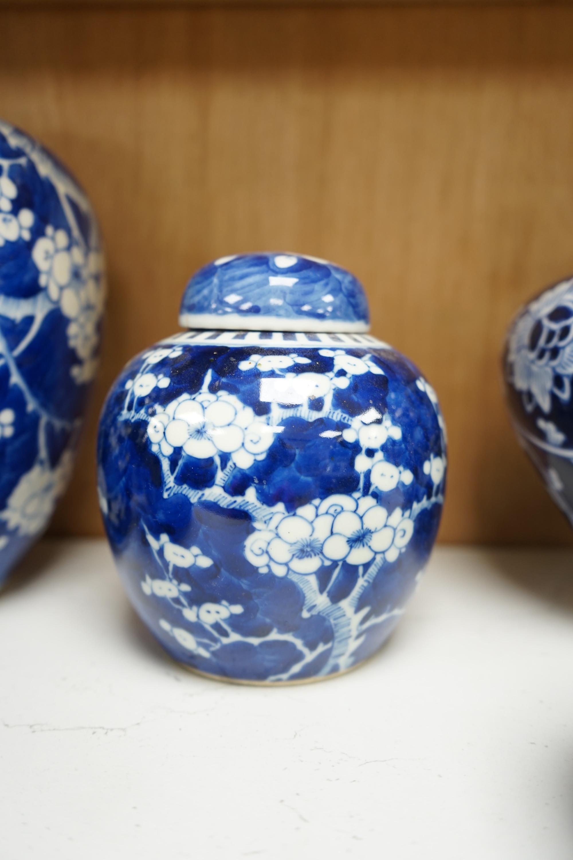 Six various Chinese prunus pattern blue and white jars, tallest 26cm. Condition - varies